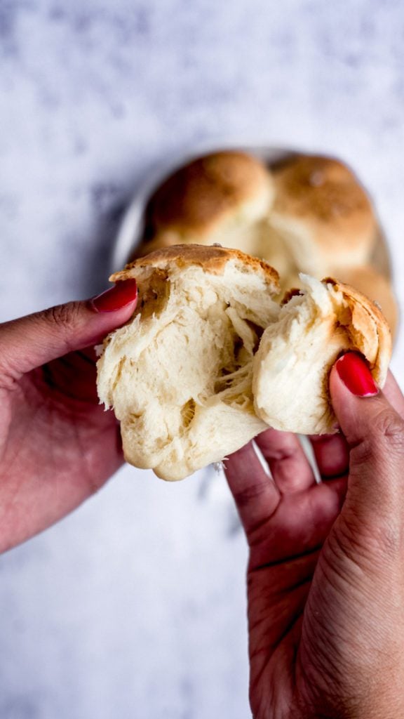 dinner rolls being pulled apart