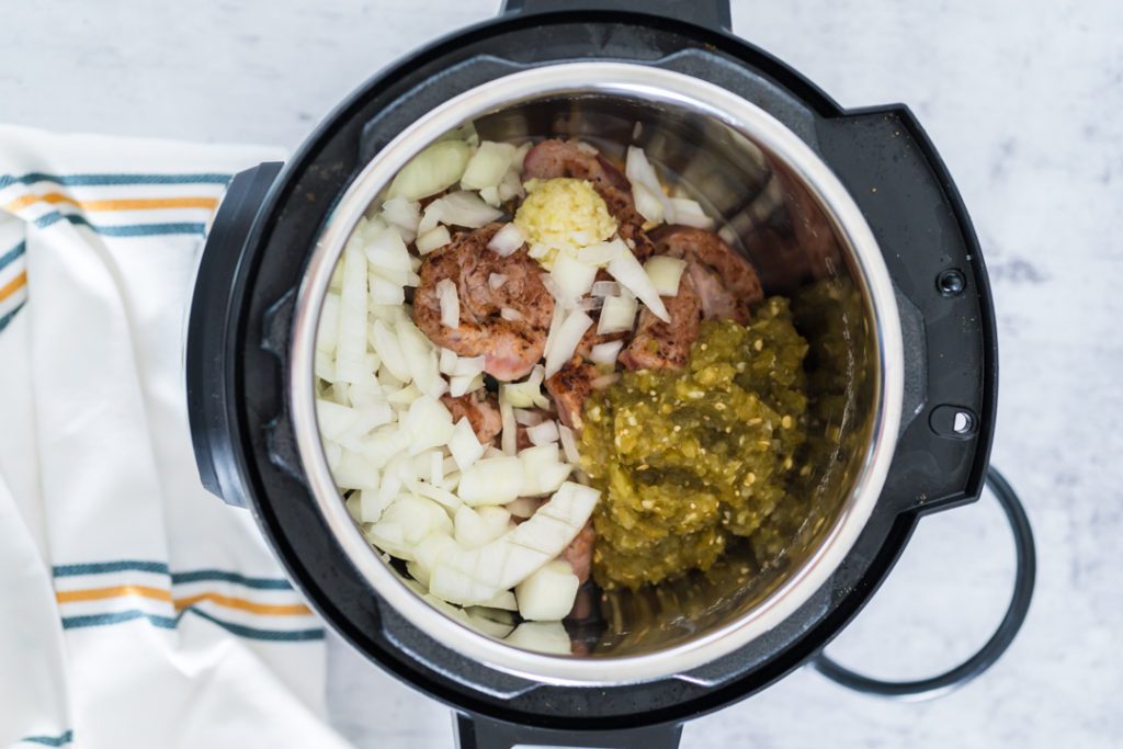 green chili sauce, pork, onion, garlic on the instant pot