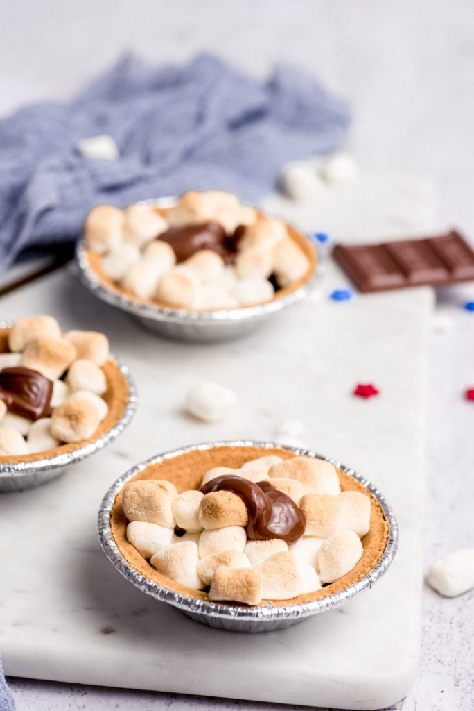 s'mores mini pies on a marble tray