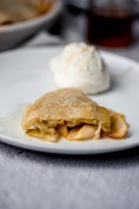 Apple Tarte Tatin served in dish with whipped cream