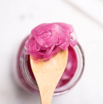 red pickled onion on spoon