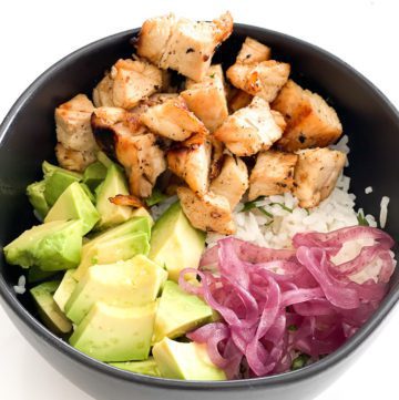 chicken, rice, avocado, pickled onion in a bowl