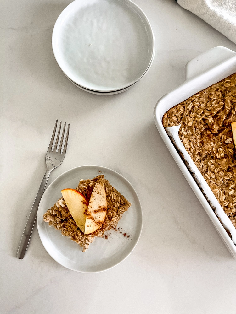 baked oatmeal on baking dish and served on a plate