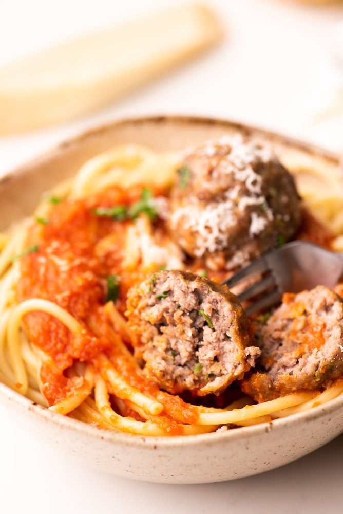 meatballs with spaghetti and red sauce on plate