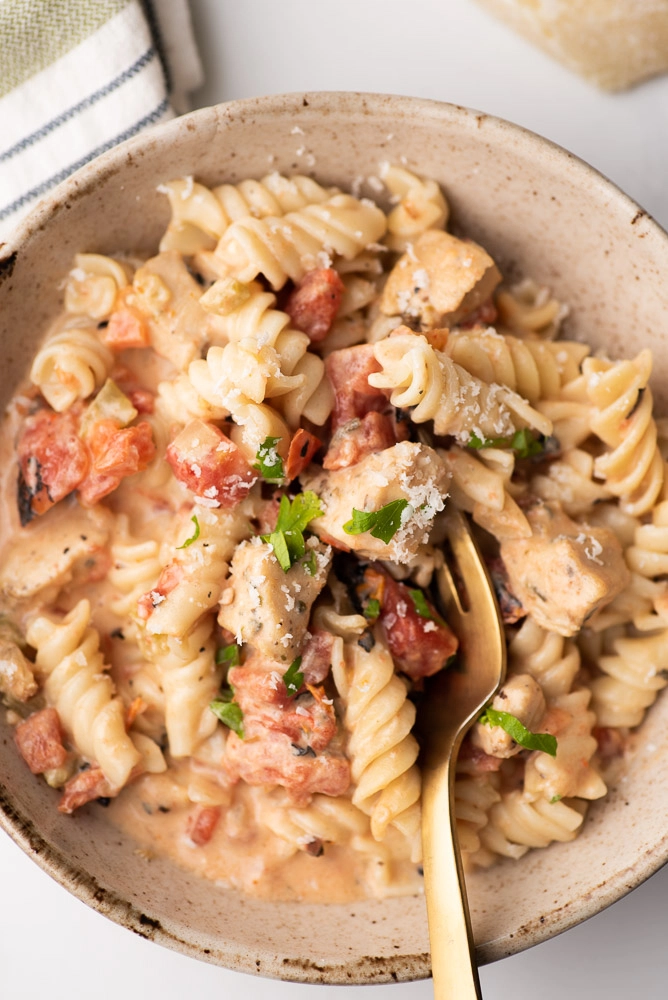 rotini pasta in bowl with fork