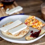 Colombian breakfast with arepa, quesito, hot chocolate and eggs