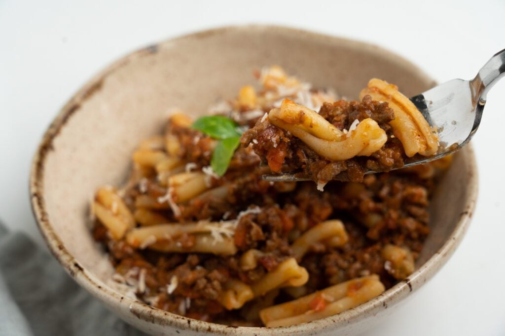Casarecce with bolognese sauce in a bowl 