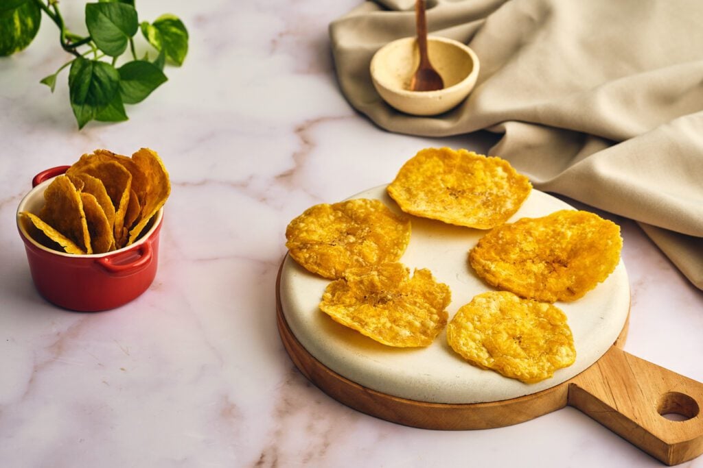 patacones on a round board and Patacones on a bowl