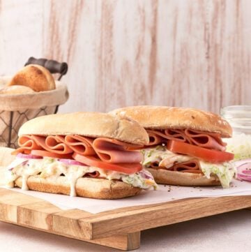 sandwich with onion, tomato, dressing