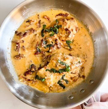 chicken in pan with cream sauce
