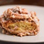 Cinnamon roll dump cake on a plate.