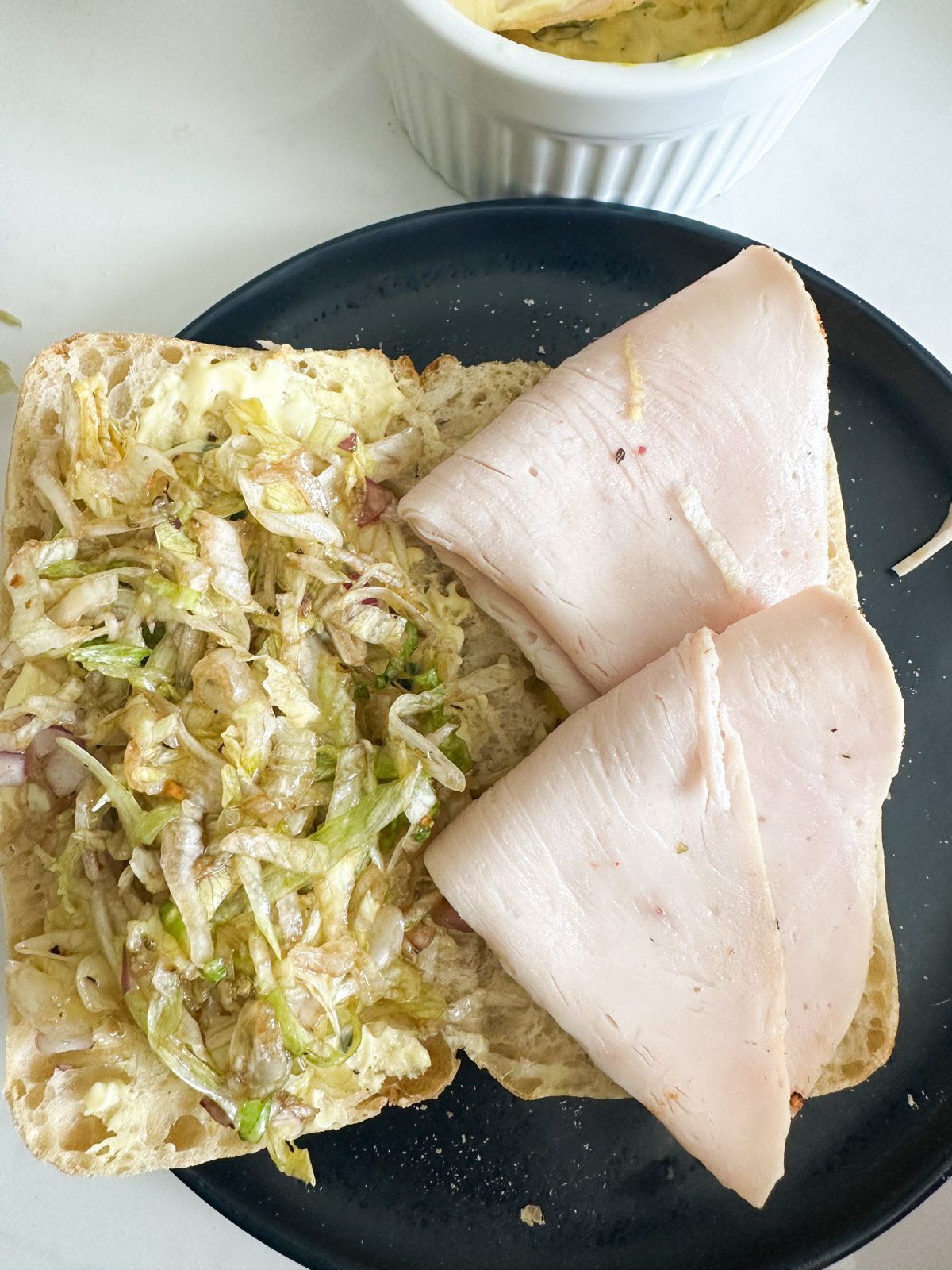 Bread with salad dressing and turkey slices