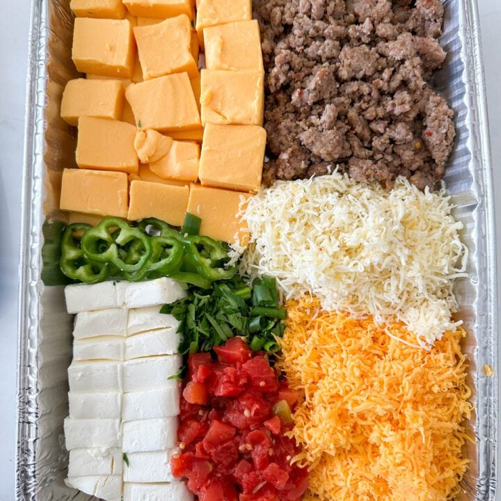 Smoked queso ingredients in an aluminum pan