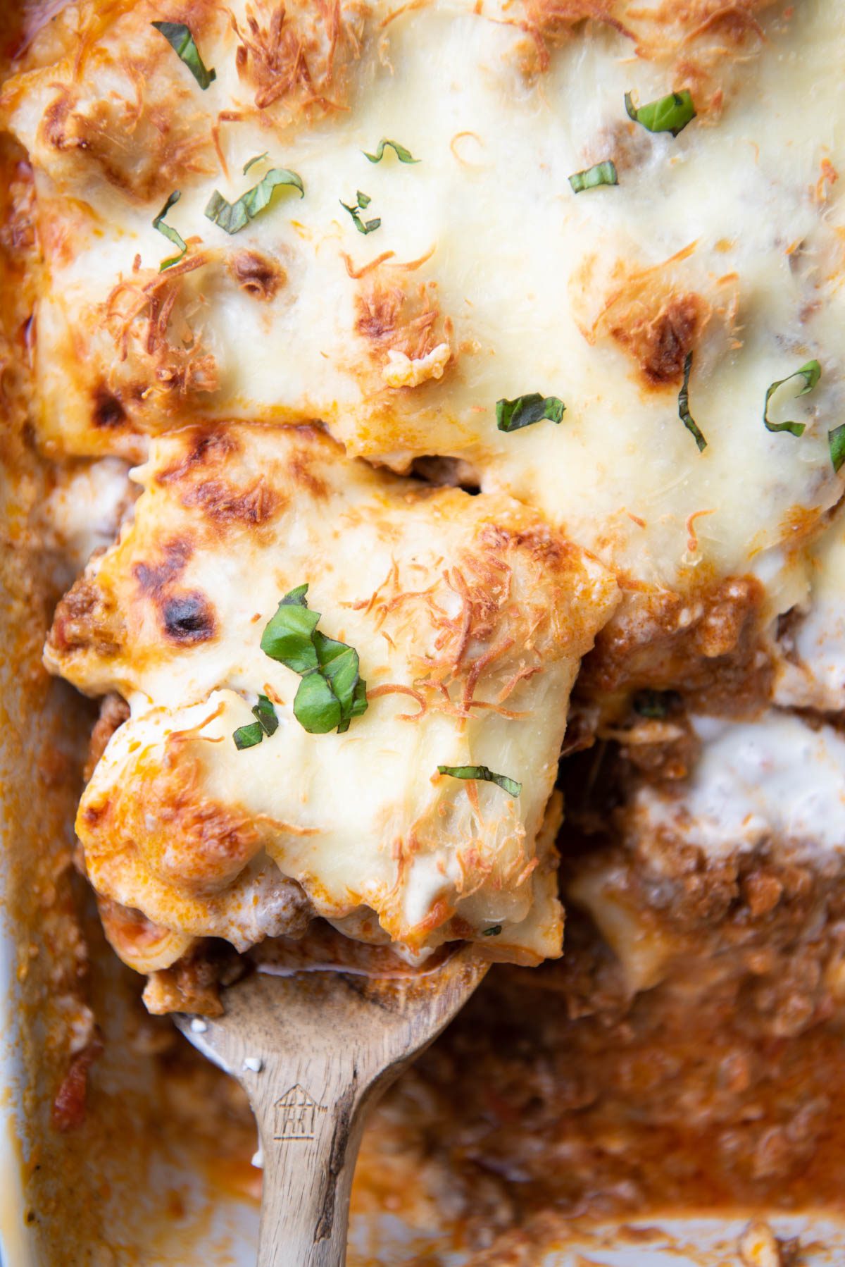 tortellini casserole with wooden spoon