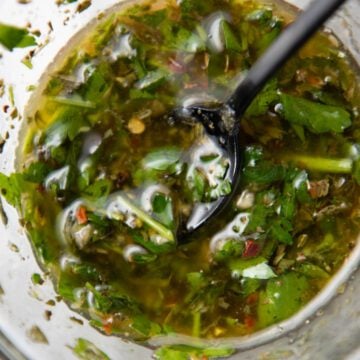 Argentinian chimichurri in a jar with a spoon