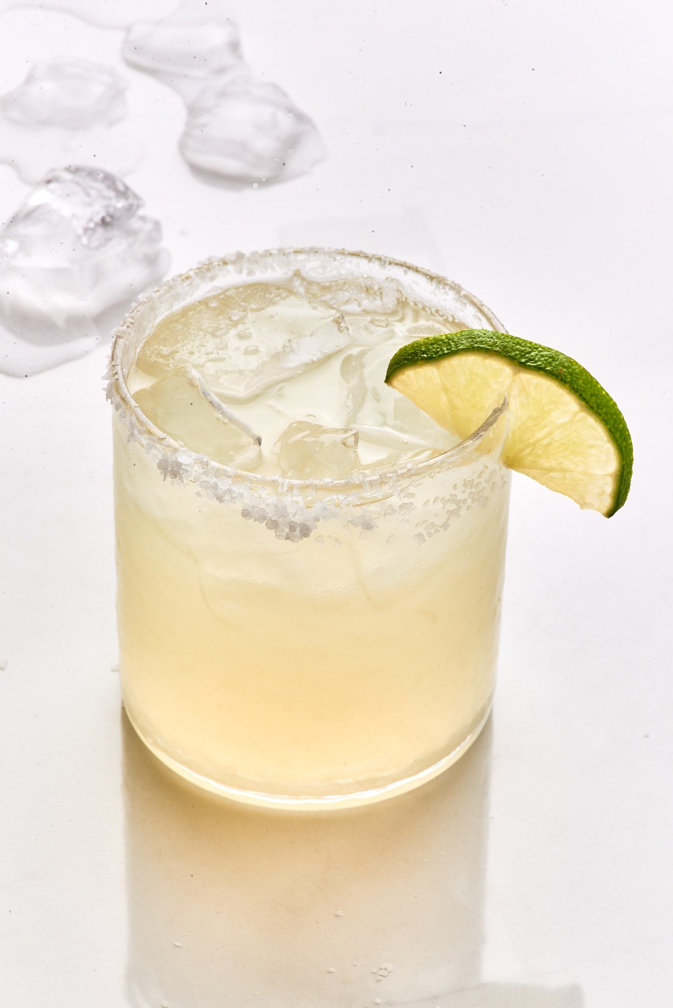 Classic Margarita with ice and lime wedge.