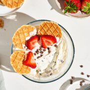 Cottage cheese dip with strawberries and chocolate chips and butter cookies.