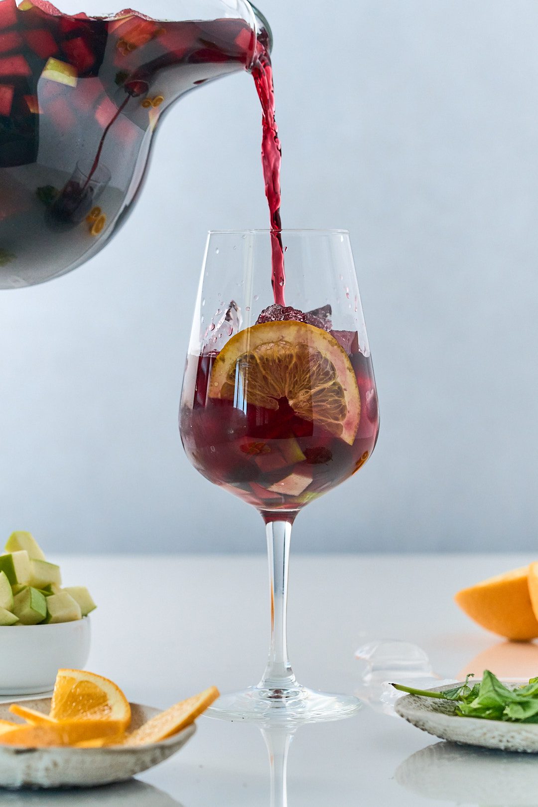 Sangria being served on a glass.