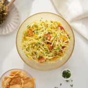 Salad in a bowl with side of tortilla chips.