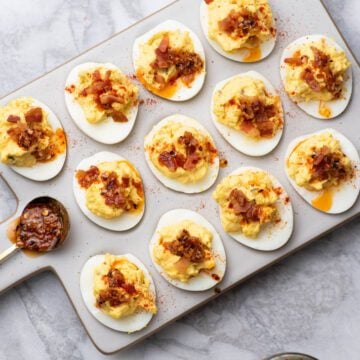 Deviled eggs on a serving tray.