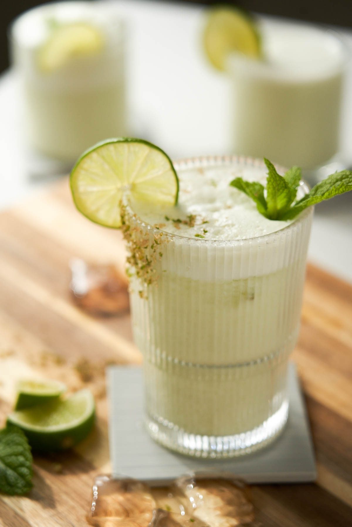 Brazilian lemonade garnished with lime and mint.
