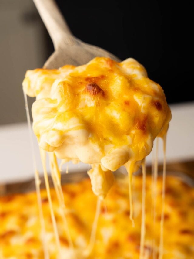 Viral Mac and cheese being scooped out of the casserole.
