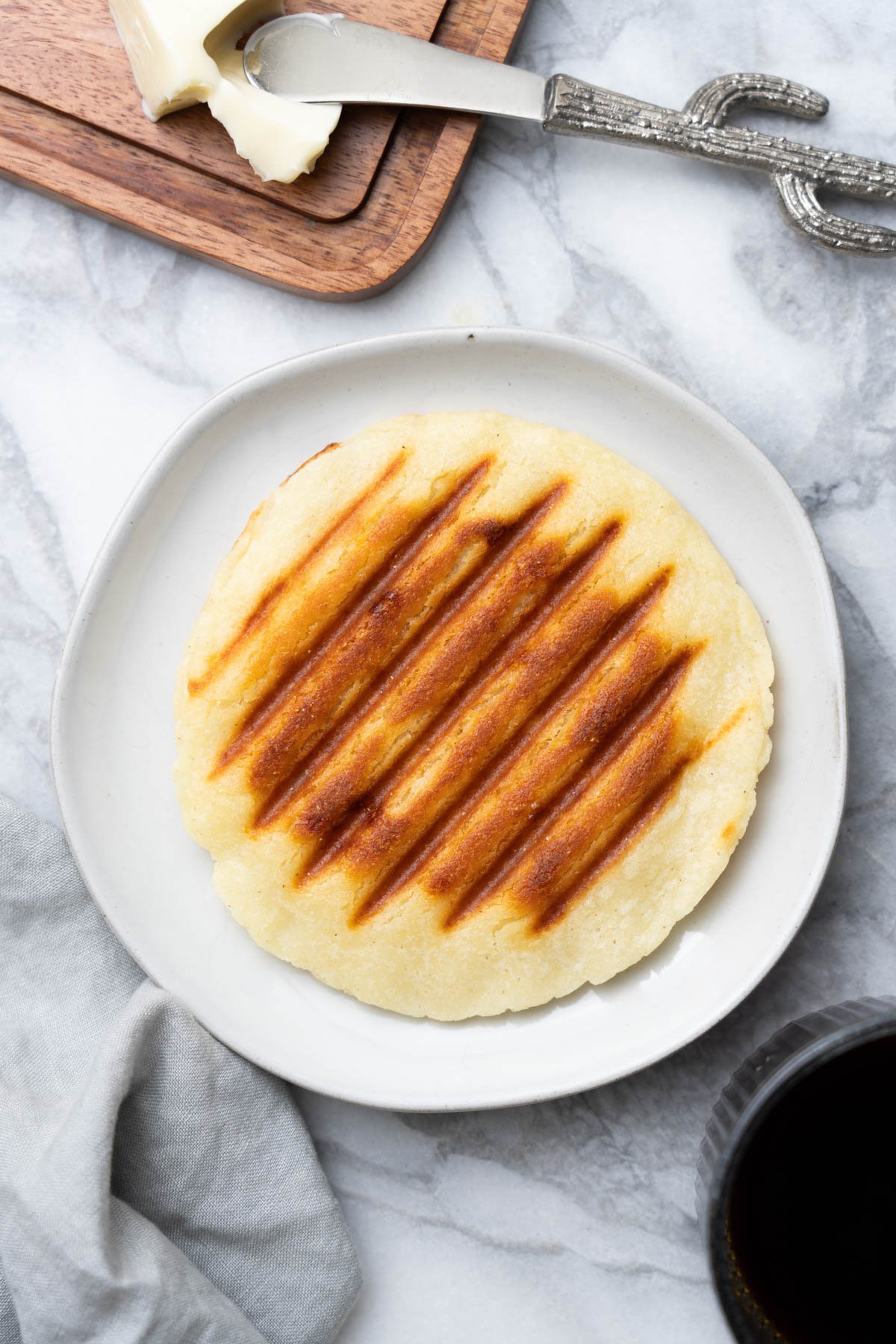 Arepas Colombianas with coffee and butter on the side.