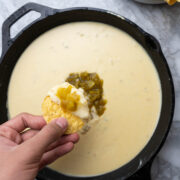 Queso Blanco dip with green Hatch Chiles in a cast iron skillet.