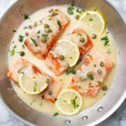 Salmon Piccata in a skillet.