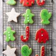 Sugar cookies with royal icing on a baking rack.
