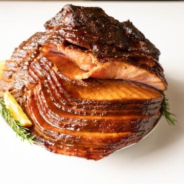 Chipotle maple syrup glazed ham on a serving platter.