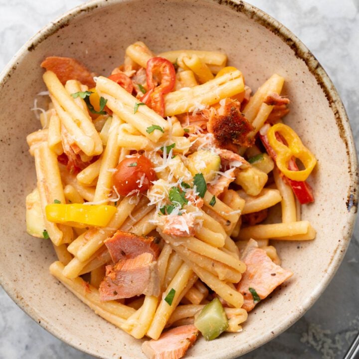 Creamy Boursin salmon pasta primavera in a bowl.