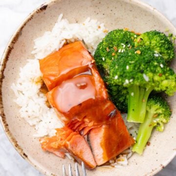 Teriyaki salmon with rice and broccoli on a bowl.