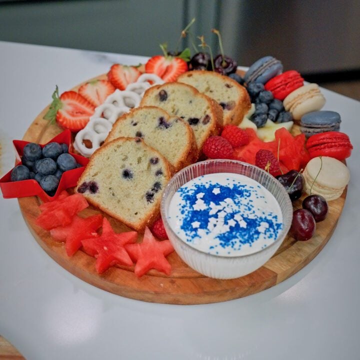 Dessert board with fruits, bread and dip.