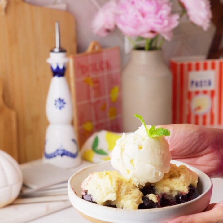 Cherry cobbler with ice cream and mint.