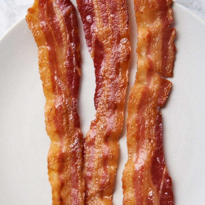 Crispy oven bacon on a plate.