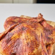 Smoked Turkey on a cutting board.
