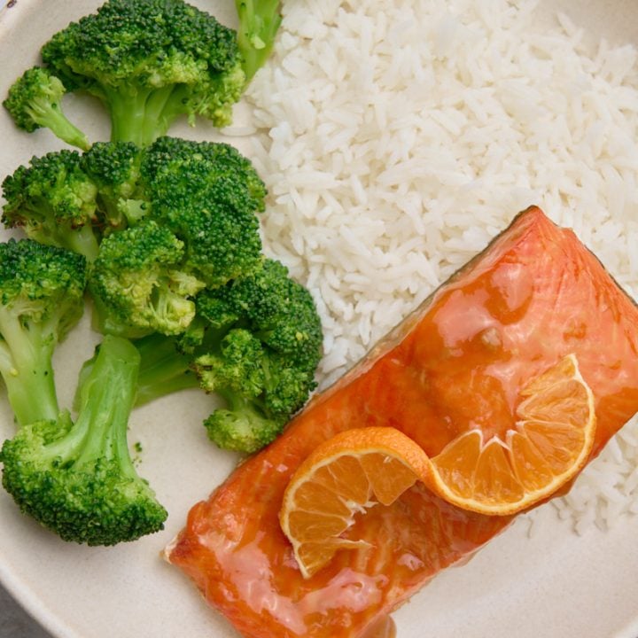 Orange glazed salmon with rice and broccoli.
