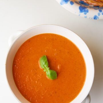 Basil tomato soup on a bowl.