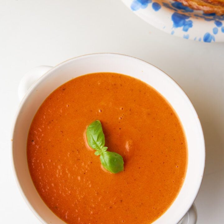Basil tomato soup on a bowl.